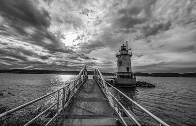 Pier over sea against sky