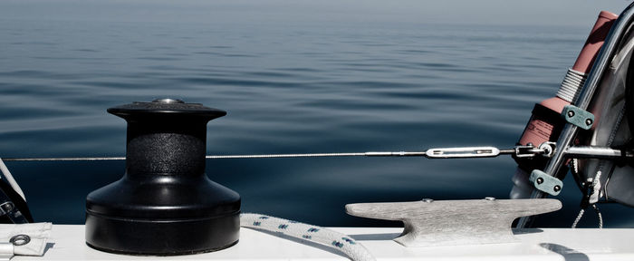 Close-up of rope tied to bollard