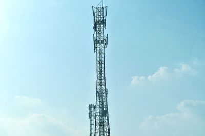 Low angle view of communications tower against sky