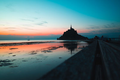 Scenic view of beach against sky during sunset