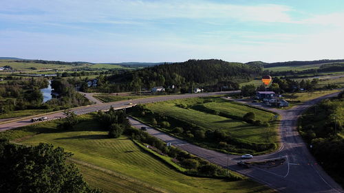 High angle view of hot air balloon on field against sky
