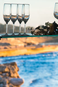Close-up of wine glasses on table