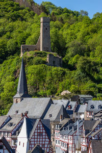 View at church and castle ruin loewenburg in monreal, eifel, germany