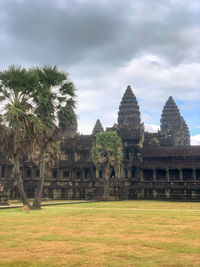 View of temple building against cloudy sky