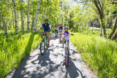 A family enjoys a bike ride on a bike path in south lake tahoe, ca