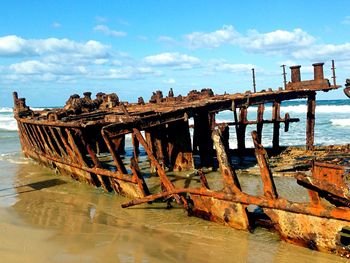 Pier on sea against sky