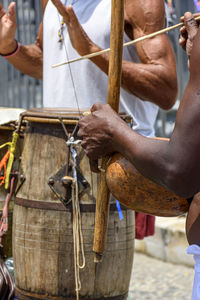 Musicians playing traditional brazilian instruments in the streets of pelourinho, salvador, bahia