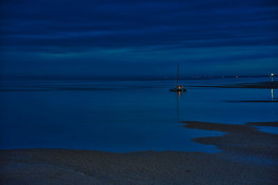 Scenic view of sea against sky at dusk