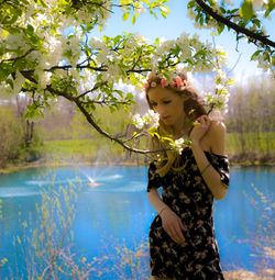 Woman by blooming tree