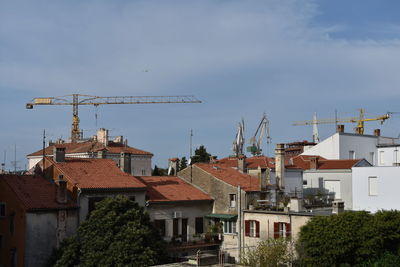 Houses and buildings against sky