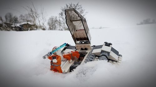 Close-up of snow against sky during winter