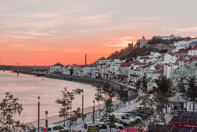 Panoramic view of city against sky at sunset