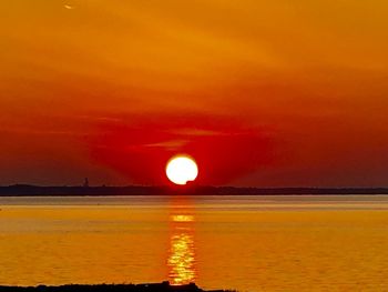 Scenic view of sea against romantic sky at sunset