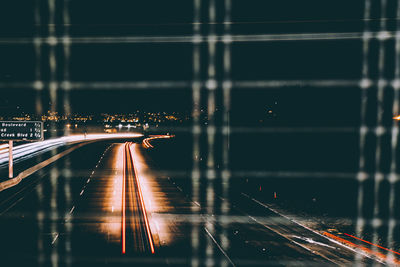 Light trails on highway in city at night