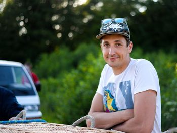 Portrait of young camper smiling in forest