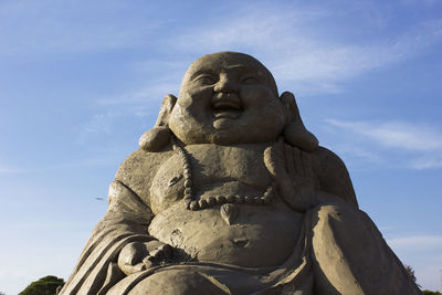 Low angle view of statue against sky