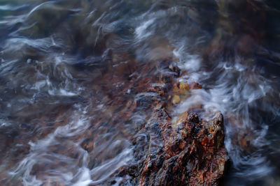 Full frame shot of water flowing through rocks