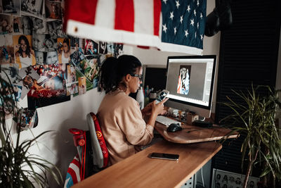 Woman using mobile phone at office