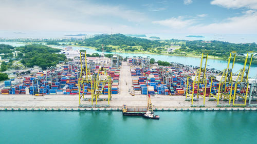 Panoramic view of commercial dock against sky