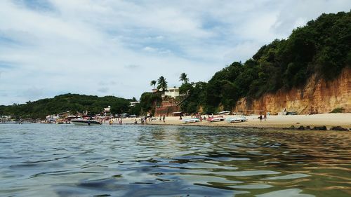 Scenic view of sea against cloudy sky