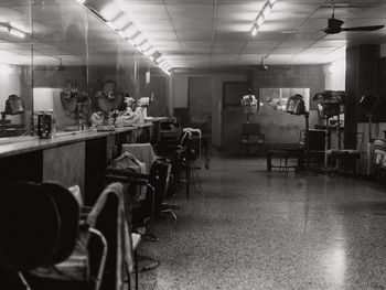 Empty chairs and tables in restaurant