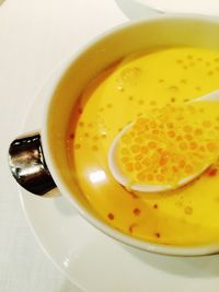 Close-up of soup in glass on table