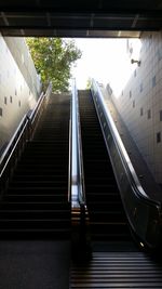 Low angle view of staircase amidst buildings in city