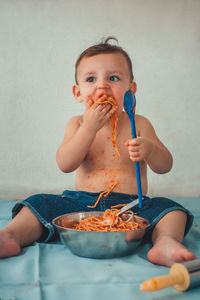 Portrait of cute boy eating food