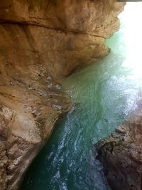 Scenic view of sea seen through cave