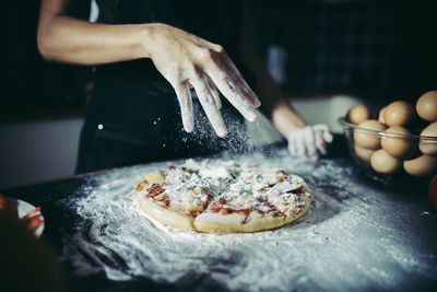 Midsection of person preparing food