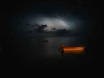 Scenic view of sea against sky at night