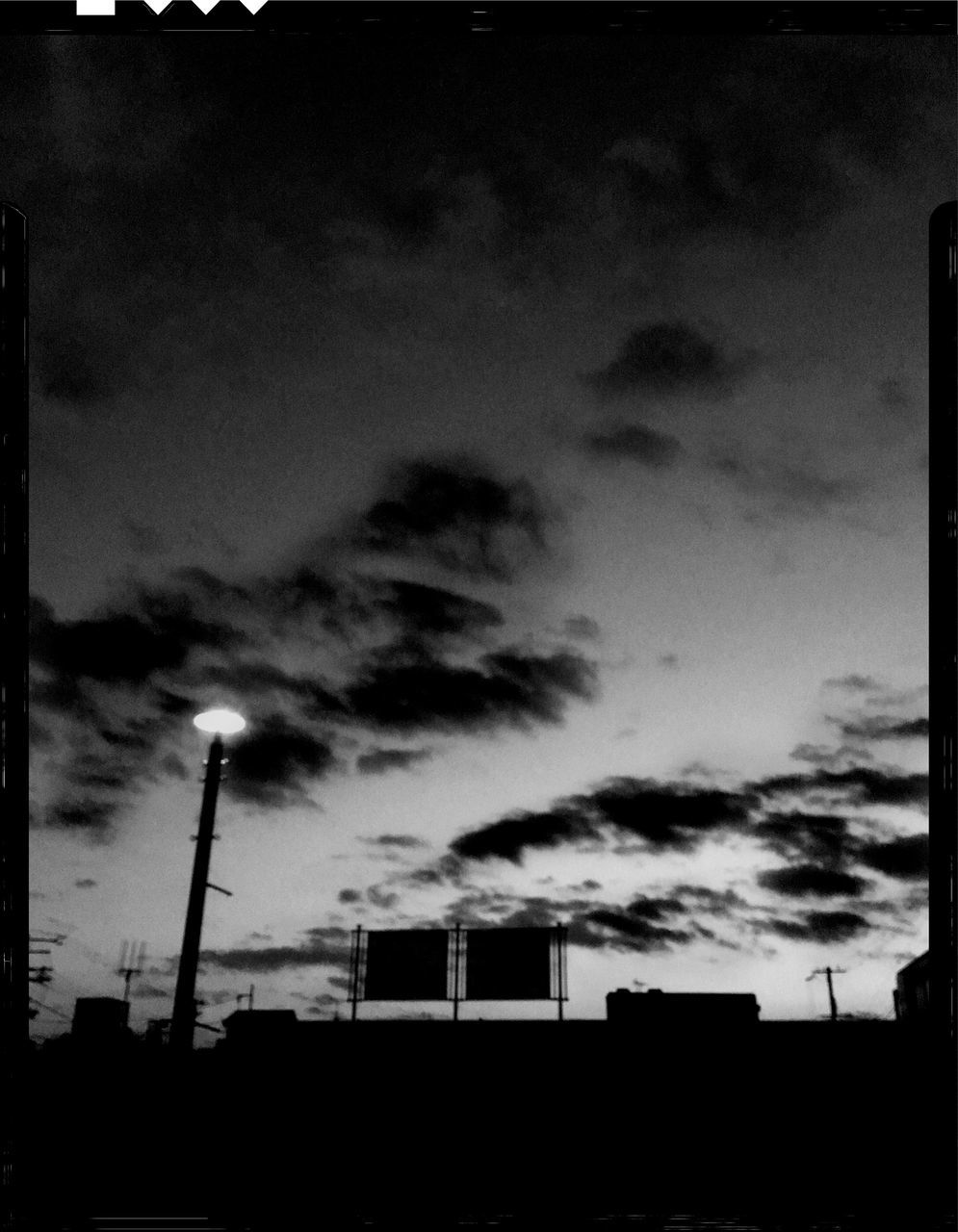 sky, cloud - sky, architecture, built structure, building exterior, silhouette, dusk, industry, no people, nature, outdoors, auto post production filter, transfer print, low angle view, smoke stack, building, factory, sunset, tall - high, pollution, air pollution, global communications, construction equipment