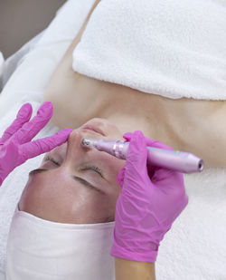 Midsection of female doctor examining patient