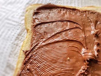 Chocolate cream spread on a slice of bread