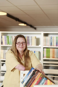 Smiling woman working in library