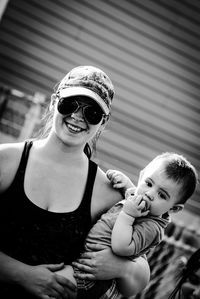 Portrait of mother with baby outdoors