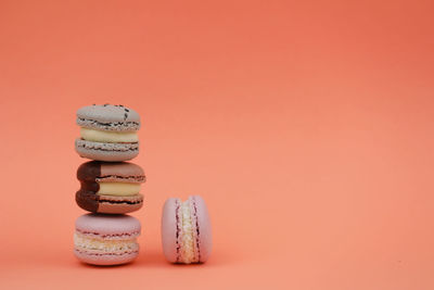 Studio shot of cookies against orange background