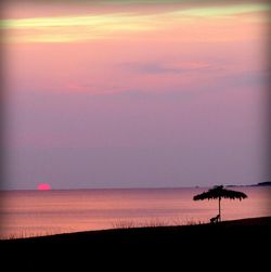 Scenic view of sea at sunset