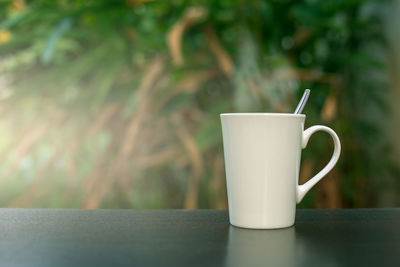 Close-up of coffee cup on table