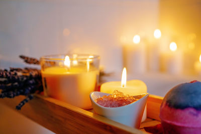 Spiritual aura cleansing flower bath for full moon ritual with bath bomb, candles, crystal salt.
