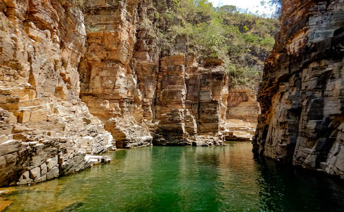 Scenic view of cave on water channel