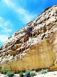 Low angle view of rock formations against sky