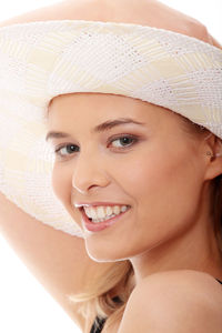 Close-up portrait of a smiling young woman