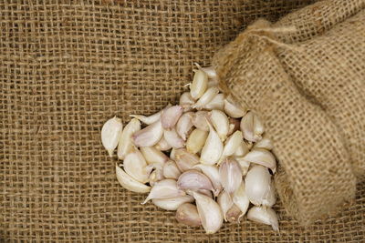 High angle view of garlics on jute