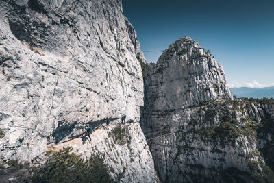 Low angle view of rock formation against sky