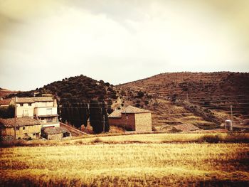House on field against sky