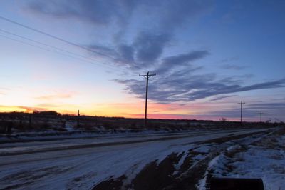 Scenic view of road at sunset