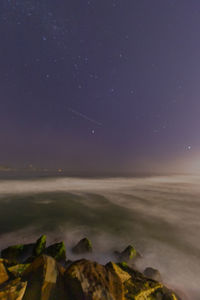 Scenic view of sea against sky at night