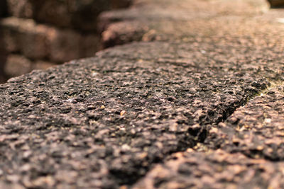 Surface level of stones on footpath