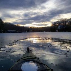 Scenic view of calm lake at sunset